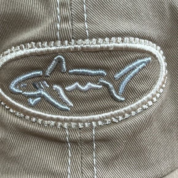 Greg Norman brand tan cap.  Velcro to adjust size in back.  Good condition. OS - Picture 2 of 8